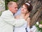 Groom and fiancee in a park