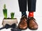 Groom, funny socks, rings, flower and bow tie