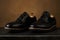 The groom is gathering in the morning. Men`s Black classic leather shoes