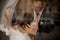 Groom gently stroking his bride on her back and hair