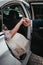 Groom give hands bride out from wedding car