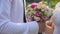 Groom gives the bride a beautiful wedding bouquet