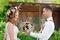 Groom gives the bride wedding bouquet