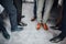 Groom and groomsmen men in blue suits standing in group with closeup of shoes and feet