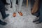 Groom and groomsmen men in blue suits standing in group with closeup of shoes and feet