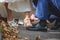 groom helping bride to change shoes