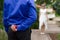 Groom hiding the wedding ring behind his back and going to offer it to a bride.