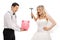 Groom holding a piggybank with a bride preparing to break it wit