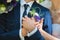 Groom husband, gently holds the hand of the bride wife