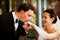 Groom kissing brides hand