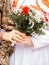 Groom in military uniform and bride with a bouquet