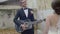 Groom playing guitar for his bride