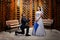 Groom proposing to the bride in a wooden gazebo