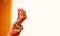 Groom puts bangle in bride hand at bangle ceremony, white background