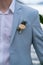Groom`s boutonniere on the groom`s jacket