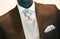 Groom\'s wedding suit detail on a mannequin