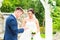 Groom slipping ring on finger of bride at wedding