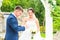 Groom slipping ring on finger of bride at wedding