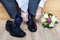 Groom in suit tying shoes