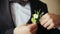 Groom takes wedding boutonniere to suit