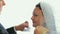 The groom throws back the veil from the face of the Jewish bride and kisses her
