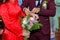 The groom is wearing a bracelet for the bride - Photo stock wedding Vietnam