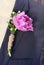 Groom wearing a purple tulip buttonhole