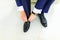 Groom wearing shoes on wedding day, tying the laces and preparing. Business man dressing up with shoes.