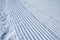 Groomed ski run track in snow
