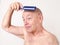 Daily Grooming Bald Man Brushing Scalp