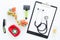 Grooming set with pets cure tools and stethoscope on white background top view