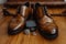Grooms essentials brown shoes, belt, perfume, golden rings Stylish details