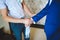 Groomsman Helping Groom with Sleeve