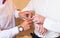 Groomsman helps groom to put on cufflinks close-up