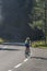 Grossglockner, Austria - Aug 8, 2020: Female athlete biker on high alpine road in summer monring