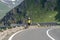 Grossglockner, Austria - Aug 8, 2020: Male athlete biker walk on High Alpine Taxenbacher Fush road