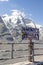 Grossglockner, Austria - Aug 8, 2020: Stamp covered sign of National Park square viewpoint of summit