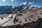 Grossglockner mountain lake rocks and yellow flowers in the foreground in the Austrian Alps in the Hohe Tauern mountains