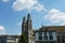 GrossmÃ¼nster Church in Zurich, lateral view from river Limmat and the surrounding historic buildings,