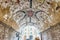 Grotesque frescoes in a vaulted arcade in Assisi, central Italy