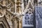 Grotesque gargoyle water spout sculpture on facade of gothic medieval St. Stephen`s Cathedral or Stephansdom in Vienna, Austria