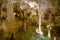 Grotta di Frasassi, Genga, Italy. Lake in the cave, Stalactites and stalagmites closeup