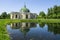 Grotto pavilion with reflection in the water park Kuskovo, Moscow, Russia