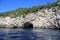 Grotto in rocky coast of southern part of island, Capri island - Italy