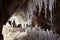 Grotto with white salty stalactites