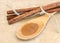 Ground cinnamon on wooden spoon