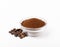 Ground coffee and beans in a bowl and loose isolated