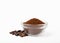 Ground coffee and beans in a bowl and loose isolated