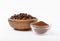 Ground coffee and beans in a bowl and loose isolated