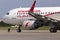 A ground control manager prepares for departing of A6-AOH Air Arabia Airbus A320-200 from Borispol International Airport